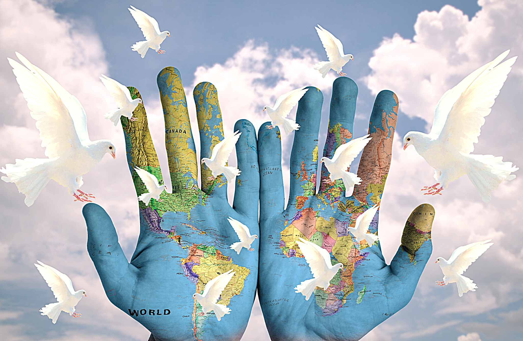 Photomontage Of Hands With World Map And Pigeons